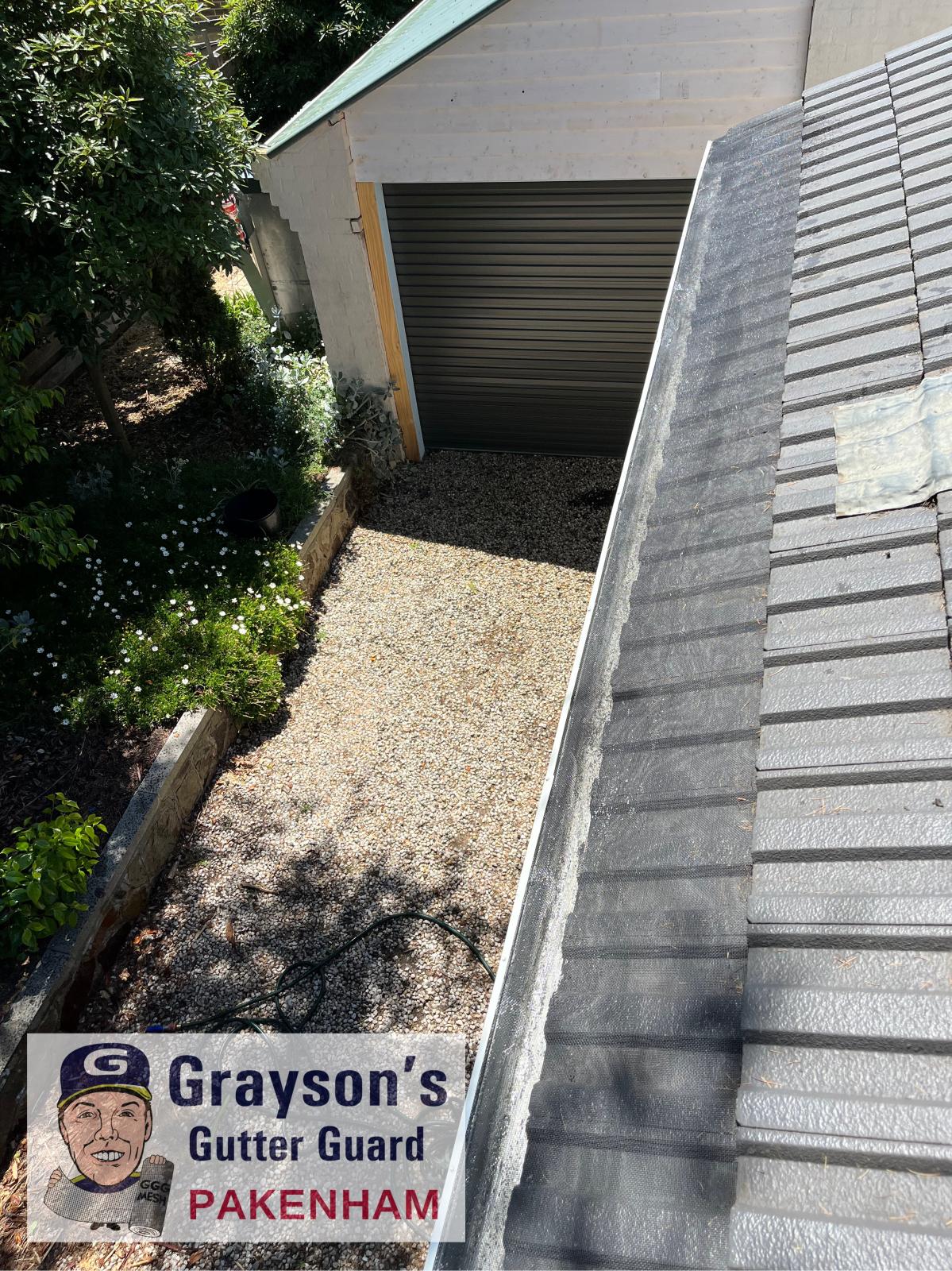 Gutter guard under tiles